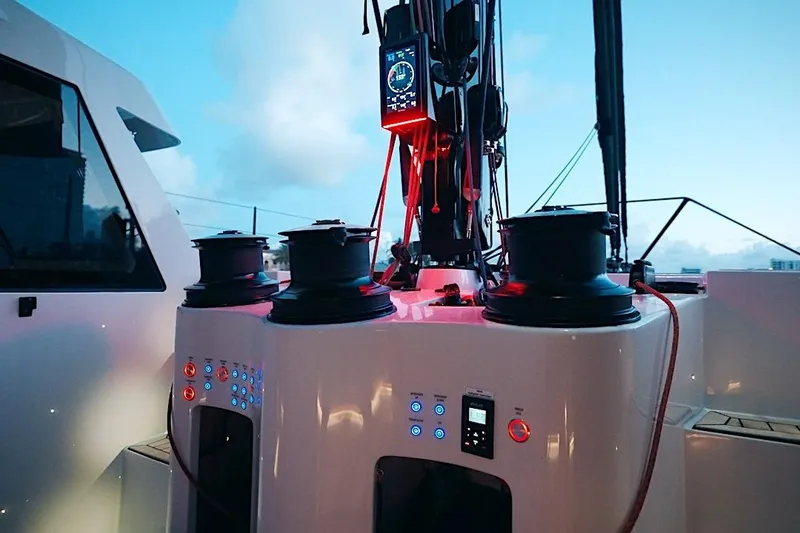 Slide: The Image of Control panel and winches on a 2026 HH Catamarans HH60 yacht at sunset. - 29