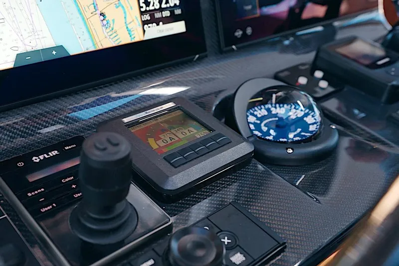 Slide: The Image of Control panel of 2026 HH Catamarans HH60, featuring navigation and monitoring instruments. - 30