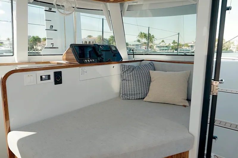 Slide: The Image of Luxurious interior of 2026 HH Catamarans HH60 with plush seating and modern navigation equipment. - 31
