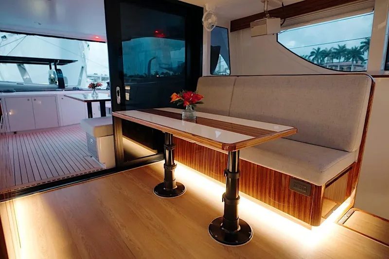 Slide: The Image of Luxurious interior of 2026 HH Catamarans HH60 with elegant seating and ambient lighting. - 32