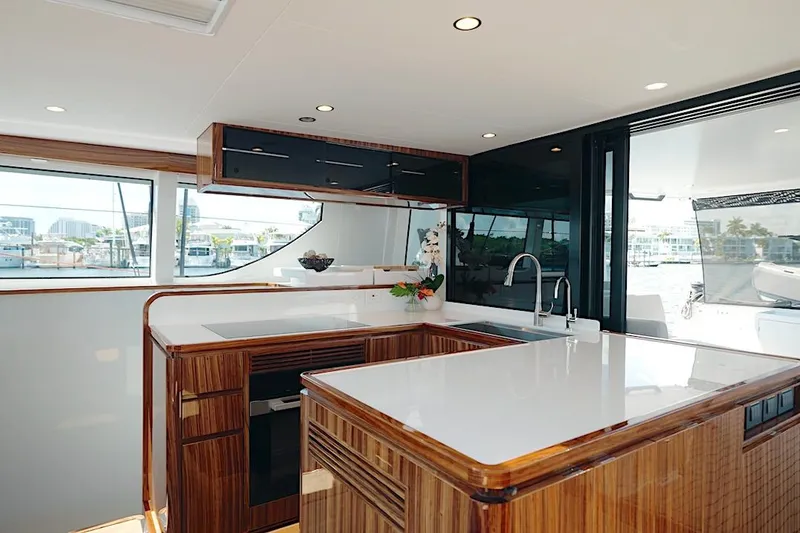 Slide: The Image of Luxurious interior of 2026 HH Catamarans HH60 with modern kitchen design. - 33