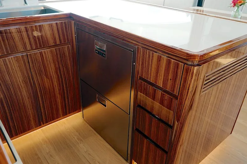 Slide: The Image of Luxurious wood-finished kitchen cabinetry in 2026 HH Catamarans HH60 yacht. - 36