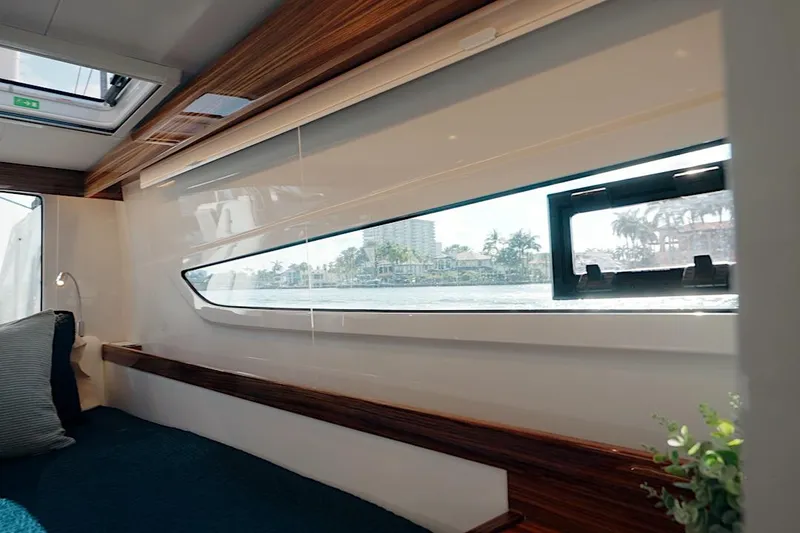 Slide: The Image of Interior view of 2026 HH Catamarans HH60 cabin with large window and modern design. - 39