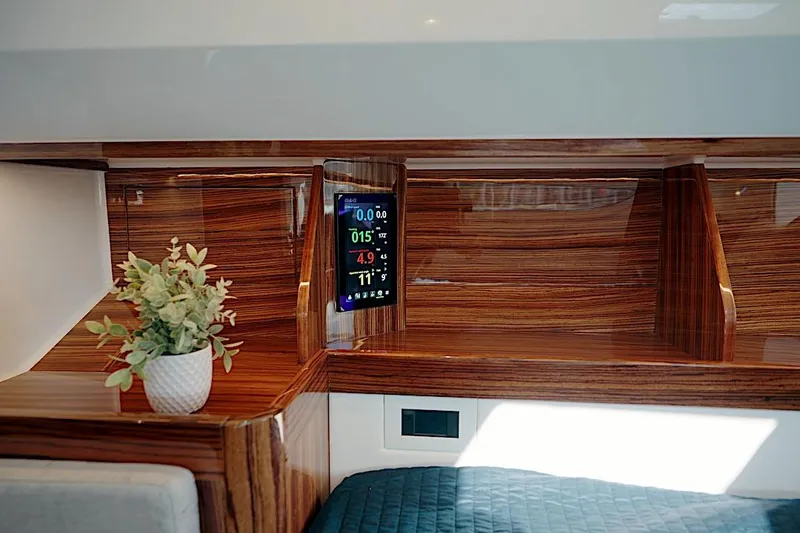 Slide: The Image of Luxurious interior of 2026 HH Catamarans HH60 with wood finish and digital display. - 40