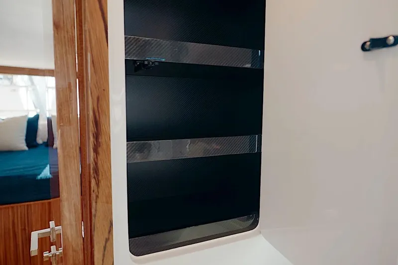 Slide: The Image of Interior of 2026 HH Catamarans HH60, featuring sleek wood and carbon fiber design elements. - 41