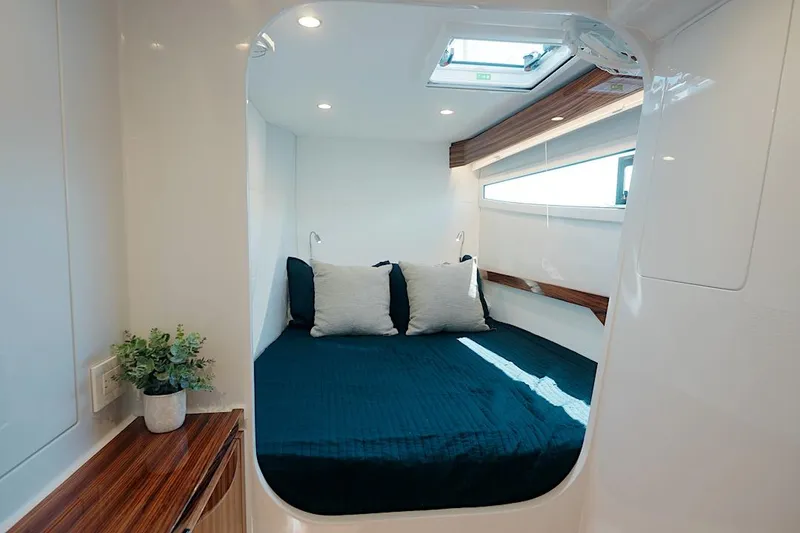 Slide: The Image of Luxurious cabin interior of 2026 HH Catamarans HH60 with modern design and cozy bedding. - 44