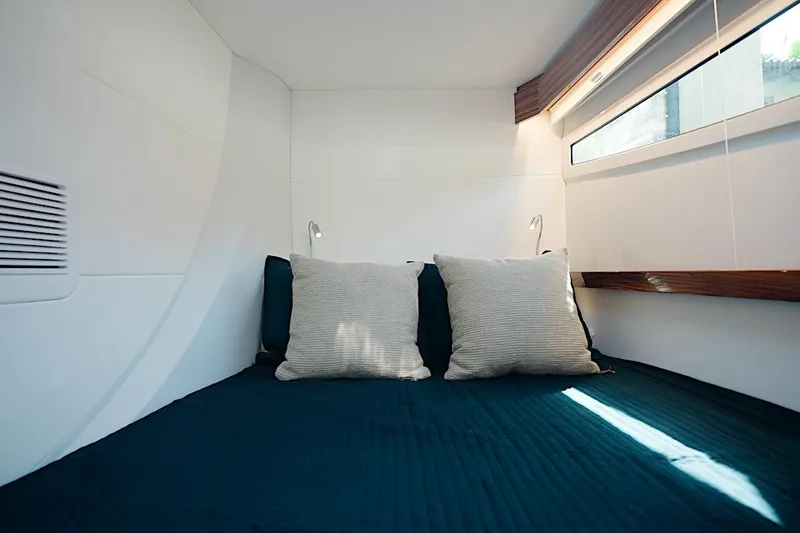 Slide: The Image of Luxurious cabin interior of 2026 HH Catamarans HH60 with cozy bedding and modern design. - 45