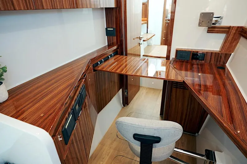 Slide: The Image of Luxurious interior of 2026 HH Catamarans HH60 with sleek wood finish and modern design. - 48