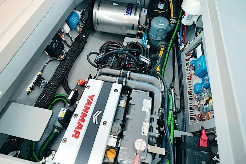 Slide: The Image of Engine room of 2026 HH Catamarans HH60, featuring Yanmar engine and electrical components. - 52