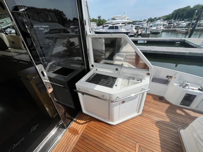 Slide: The Image of Outdoor kitchen on 2014 Azimut 55S yacht with grill and sink, docked at marina. - 11