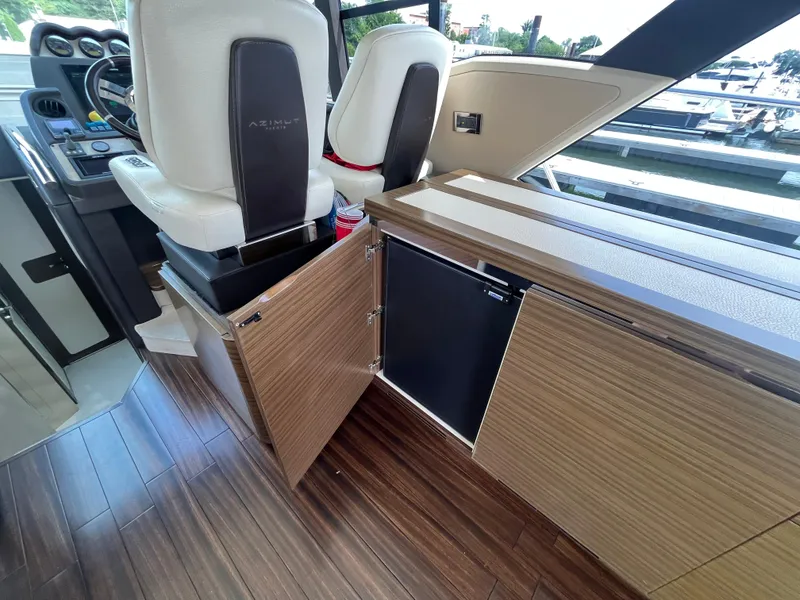 Slide: The Image of Interior of 2014 Azimut 55S yacht with wood flooring and modern seating. - 16
