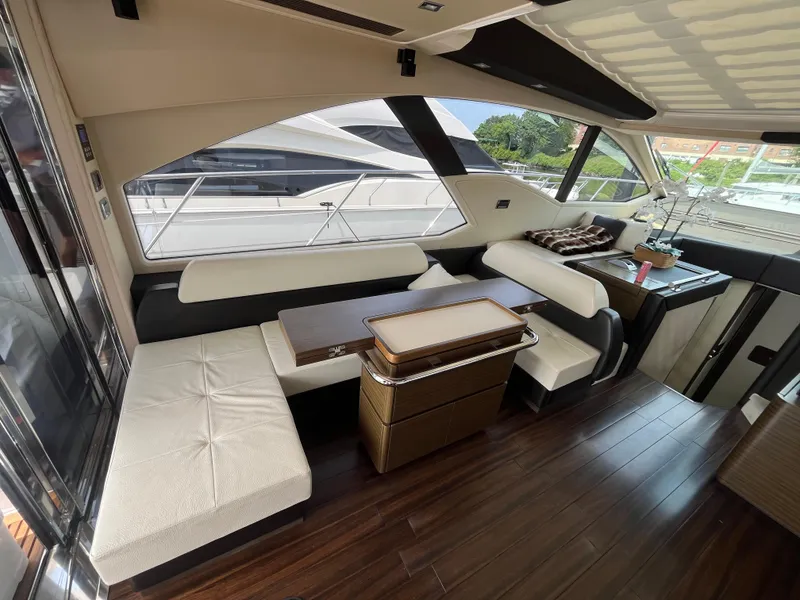 Slide: The Image of Luxurious interior of a 2014 Azimut 55S yacht with elegant seating and wooden flooring. - 17