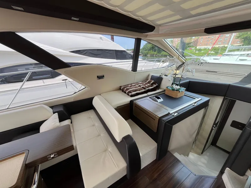 Slide: The Image of Luxurious interior of a 2014 Azimut 55S yacht with elegant seating and decor. - 18