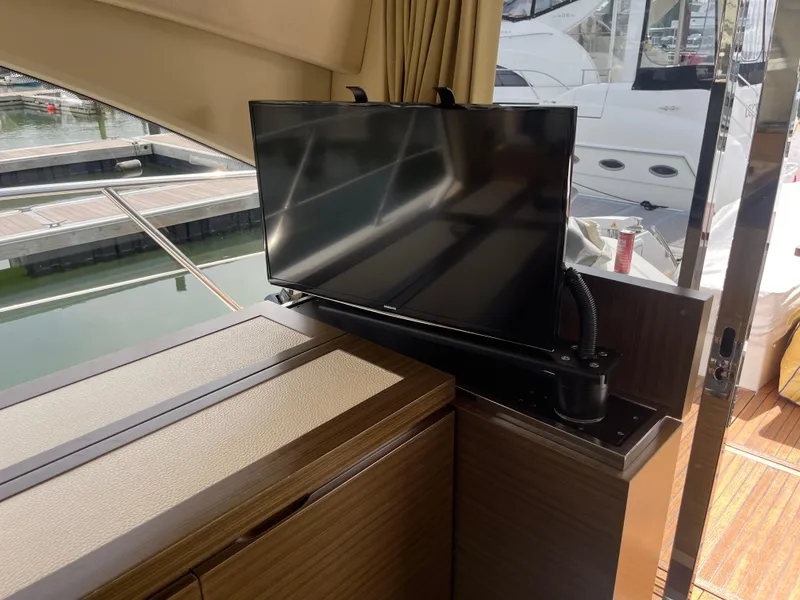 Slide: The Image of Luxurious interior of 2014 Azimut 55S yacht with modern TV setup. - 23