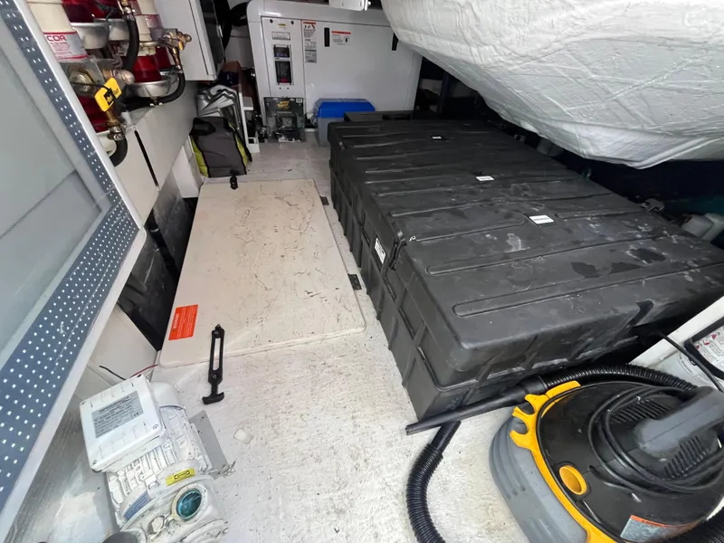 Slide: The Image of Engine room of a 2014 Azimut 55S yacht with equipment and storage. - 35