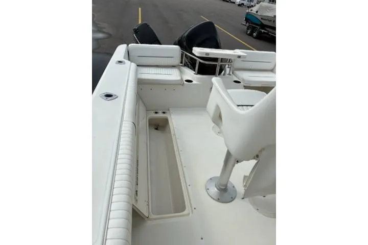 Slide: The Image of 1999 Boston Whaler 21 Outrage boat interior with seating and storage compartments. - 10