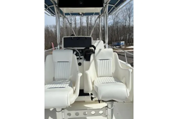 Slide: The Image of 1999 Boston Whaler 21 Outrage boat interior with dual white captain seats. - 5