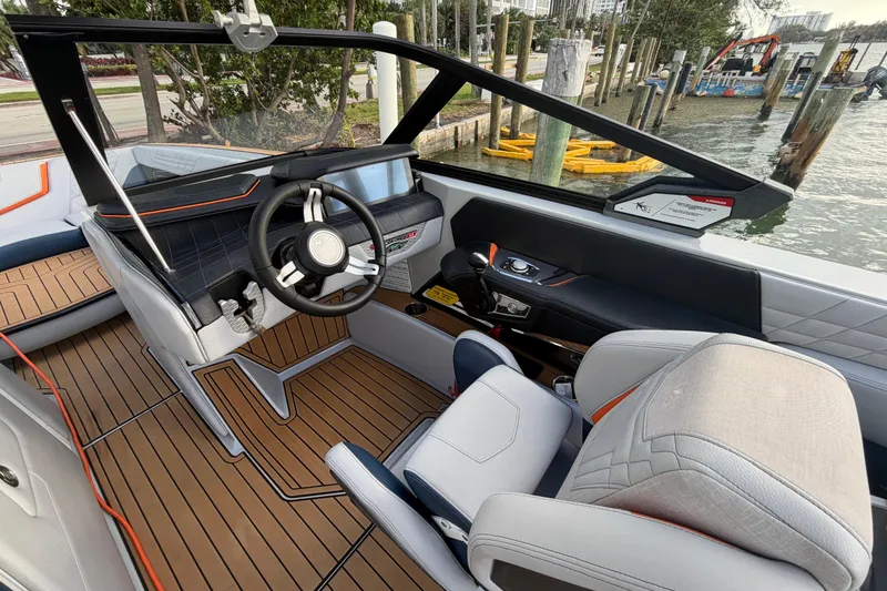 Slide: The Image of 2022 Nautique Super Air Nautique G25 interior with sleek design and modern controls. - 13