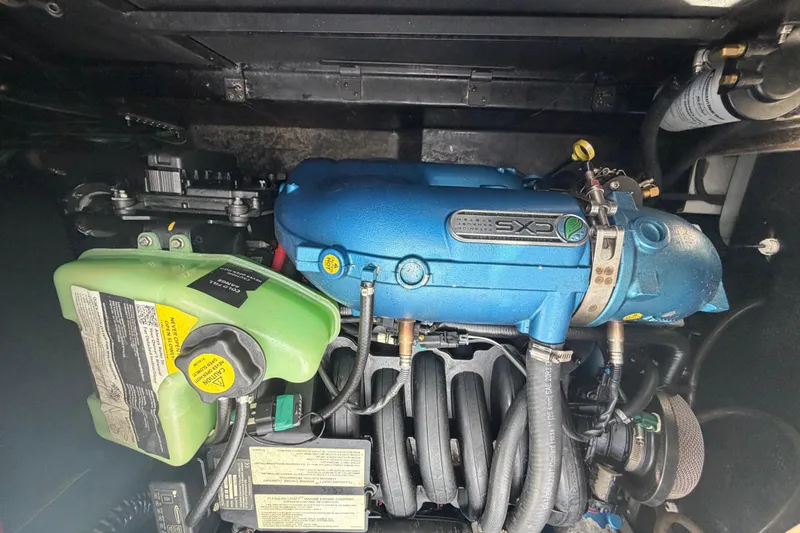 Slide: The Image of 2022 Nautique Super Air Nautique G25 engine, featuring a blue CXS exhaust system. - 22