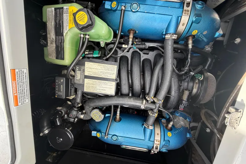 Slide: The Image of Engine of 2022 Nautique Super Air Nautique G25 boat, showcasing intricate components. - 25