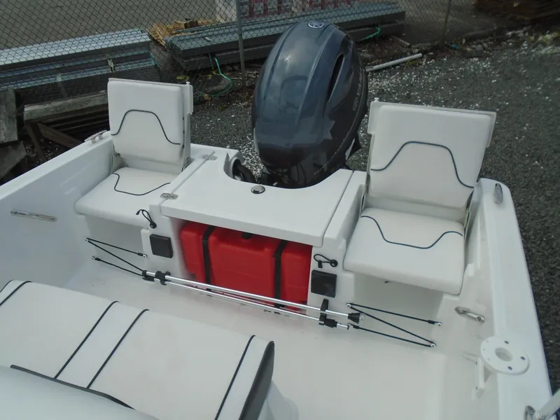Slide: The Image of 2021 Wellcraft 162 Fisherman boat rear with motor and seating. - 11