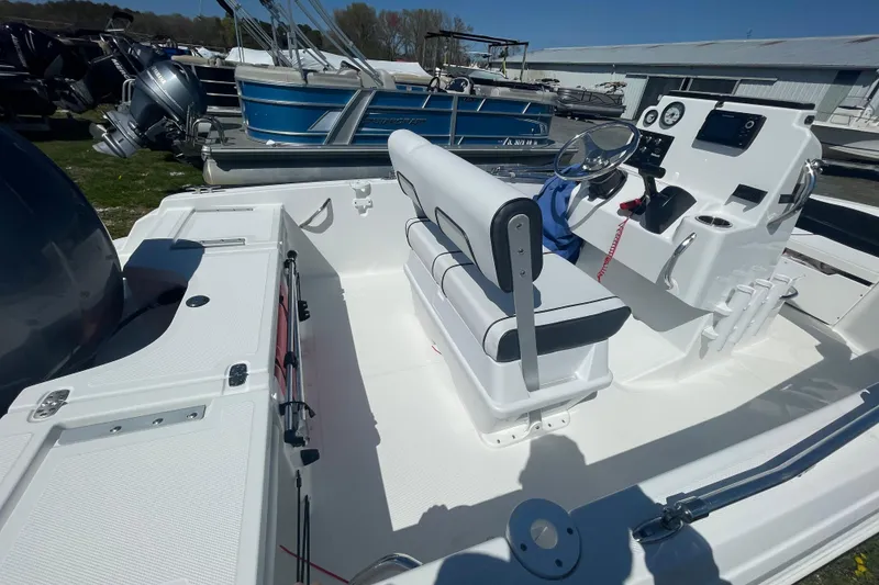 Slide: The Image of 2021 Wellcraft 162 Fisherman boat interior with steering console and seating. - 3