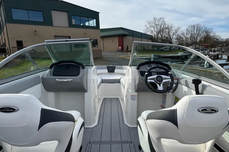 Slide: The Image of Interior view of 2026 Chaparral 19 SSi OB boat with modern dashboard and seating. - 10