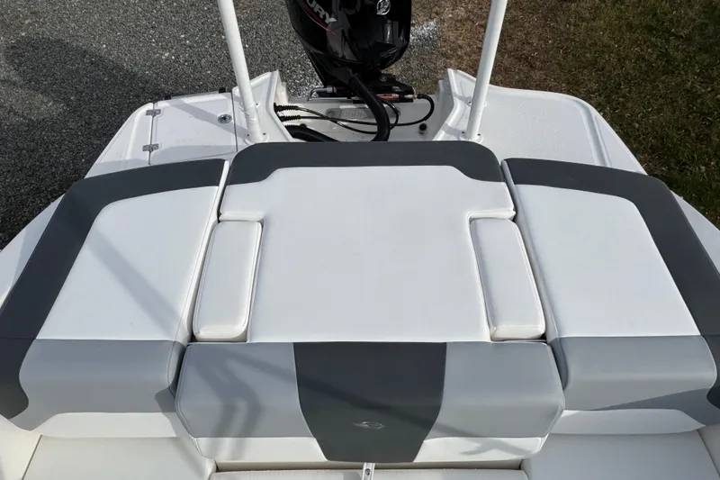 Slide: The Image of 2026 Chaparral 19 SSi OB boat with cushioned seating and outboard motor. - 5