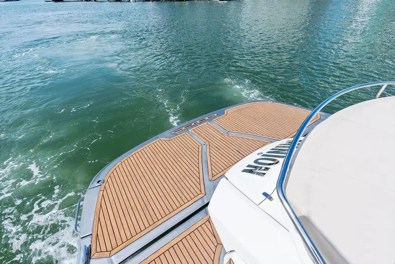 Slide: The Image of Cranchi 56 HT 2014 yacht with teak deck on calm water. - 18