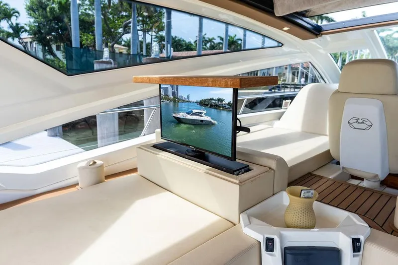 Slide: The Image of Luxurious interior of 2014 Cranchi 56 HT yacht with TV and elegant seating. - 26