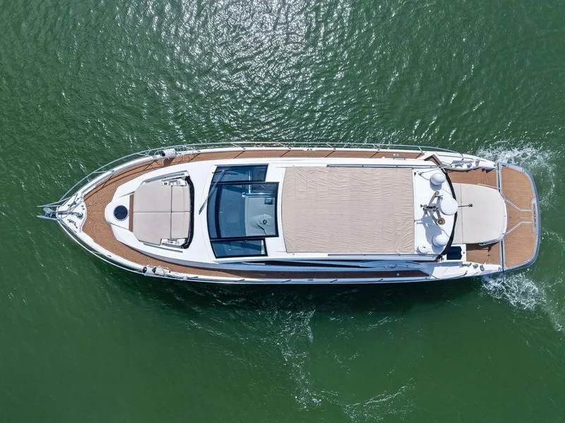 Slide: The Image of Aerial view of 2014 Cranchi 56 HT yacht cruising on green water. - 3