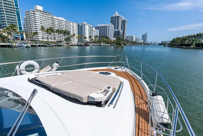 Slide: The Image of Cranchi 56 HT yacht cruising near waterfront cityscape, 2014 model. - 31