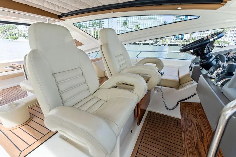 Slide: The Image of Luxurious interior of 2014 Cranchi 56 HT yacht with plush seating and modern controls. - 36