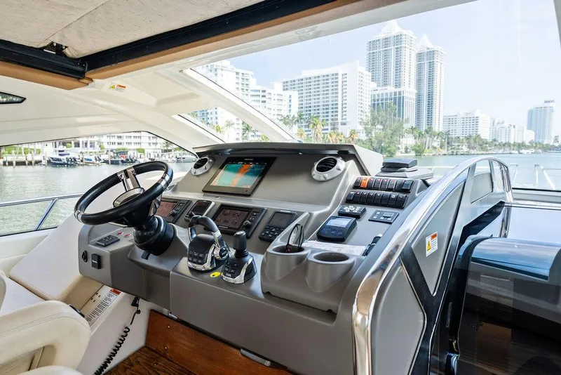 Slide: The Image of Helm of 2014 Cranchi 56 HT yacht with city skyline view. - 37
