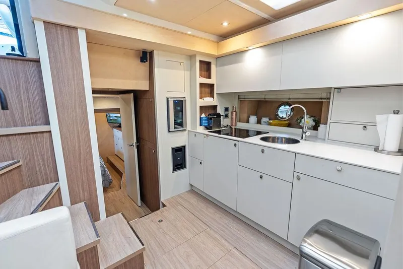 Slide: The Image of Luxurious 2014 Cranchi 56 HT yacht interior with modern kitchen and sleek cabinetry. - 45