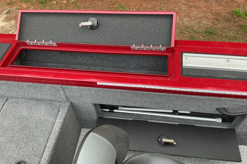 Slide: The Image of 2020 Tracker Targa V-18 WT boat interior with open storage compartments. - 12