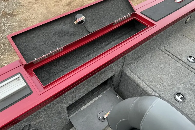 Slide: The Image of 2020 Tracker Targa V-18 WT boat interior with open storage compartment and seating. - 13