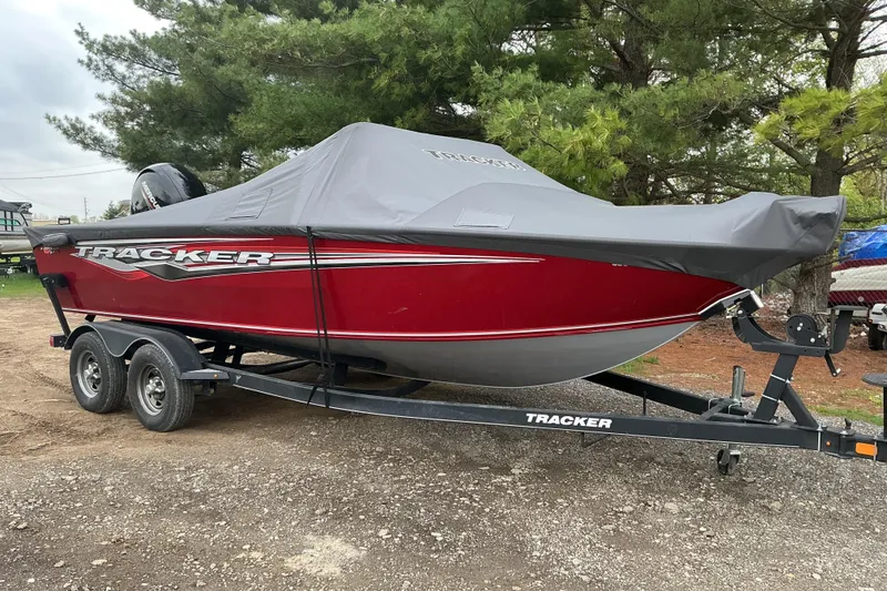 Slide: The Image of 2020 Tracker Targa V-18 WT boat on trailer, covered, parked outdoors. - 15