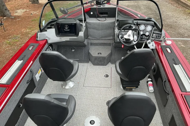 Slide: The Image of 2020 Tracker Targa V-18 WT boat interior with four seats and steering console. - 5
