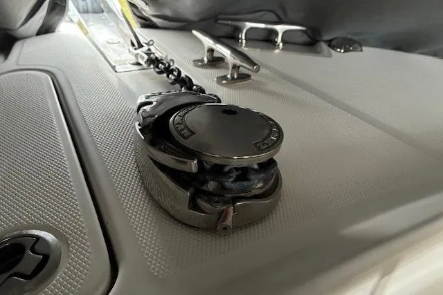 Slide: The Image of 2015 Edgewater 245CC boat deck with anchor chain and cleat. - 14