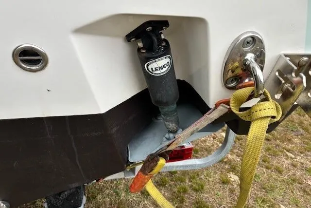 Slide: The Image of Edgewater 245CC 2015 boat with Lenco trim tab actuator and securing straps. - 3