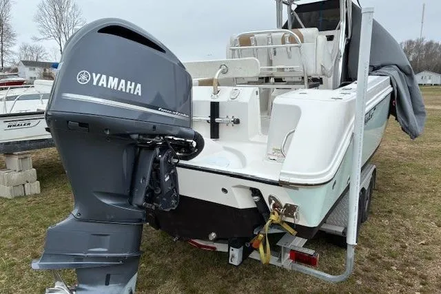 Slide: The Image of 2015 Edgewater 245CC boat with Yamaha outboard motor on a trailer. - 6