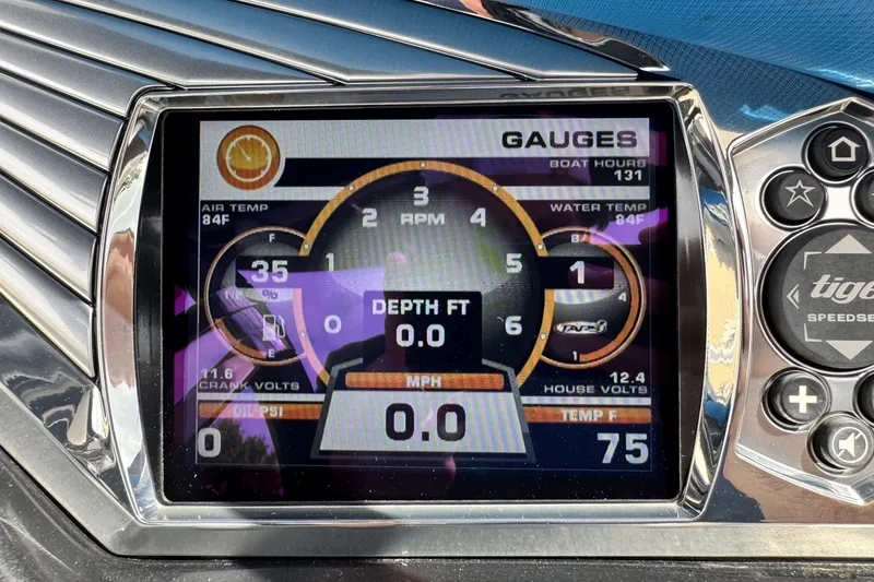 Slide: The Image of Dashboard display of a 2013 Tigé RZ4 boat showing gauges and controls. - 13