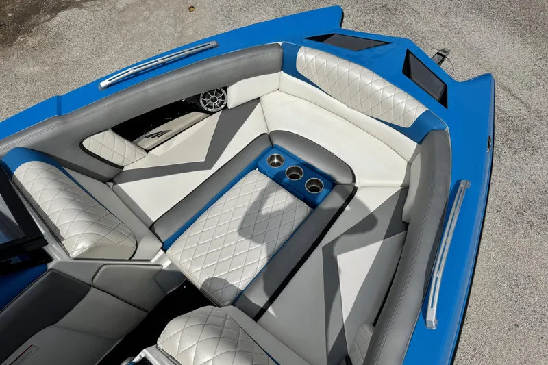 Slide: The Image of Luxurious interior of a 2013 Tigé RZ4 boat with blue and white seating. - 14