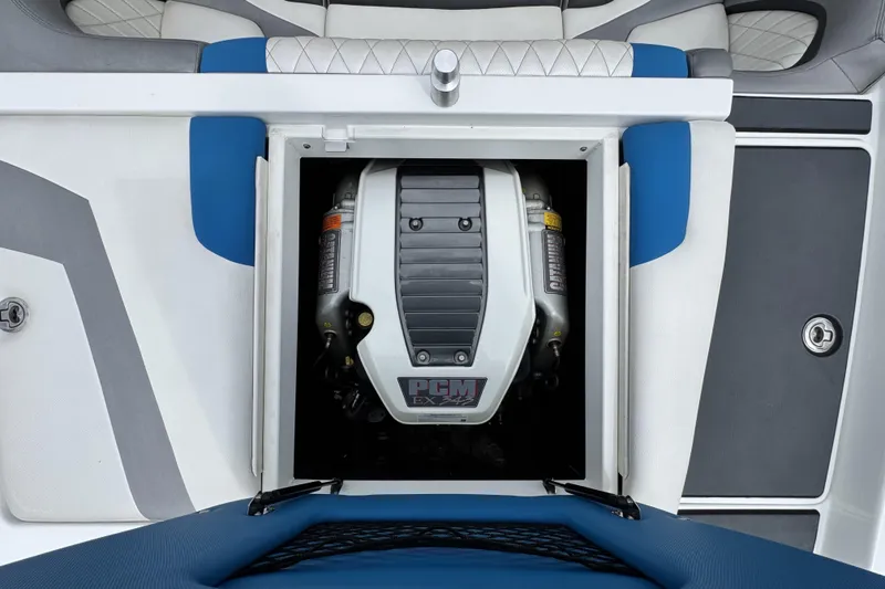 Slide: The Image of Engine compartment of a 2013 Tigé RZ4 boat, featuring a PCM EX343 engine. - 19