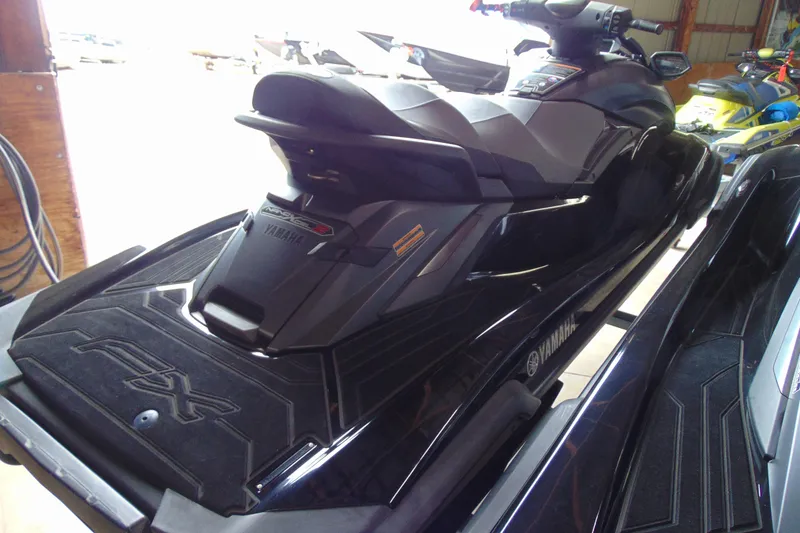 Slide: The Image of 2021 Yamaha WaveRunner FX Cruiser SVHO in a showroom, showcasing sleek design and features. - 6