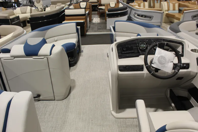 Slide: The Image of Interior view of 2026 Avalon 2185 25 LSZ CRB pontoon boat with modern seating and helm. - 2