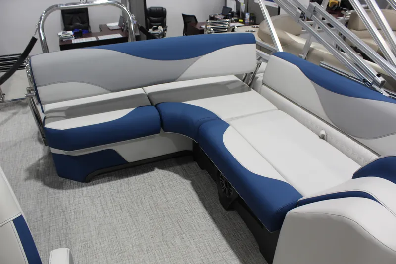 Slide: The Image of 2026 Avalon 2185 25 LSZ CRB boat interior with blue and white seating. - 6