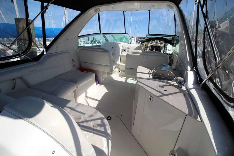 Slide: The Image of 2008 Maxum 2900 SE boat interior with seating and helm, featuring a sleek design. - 14