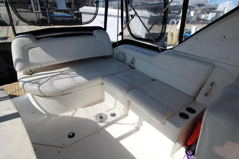 Slide: The Image of 2008 Maxum 2900 SE boat interior with white seating and cup holders. - 15